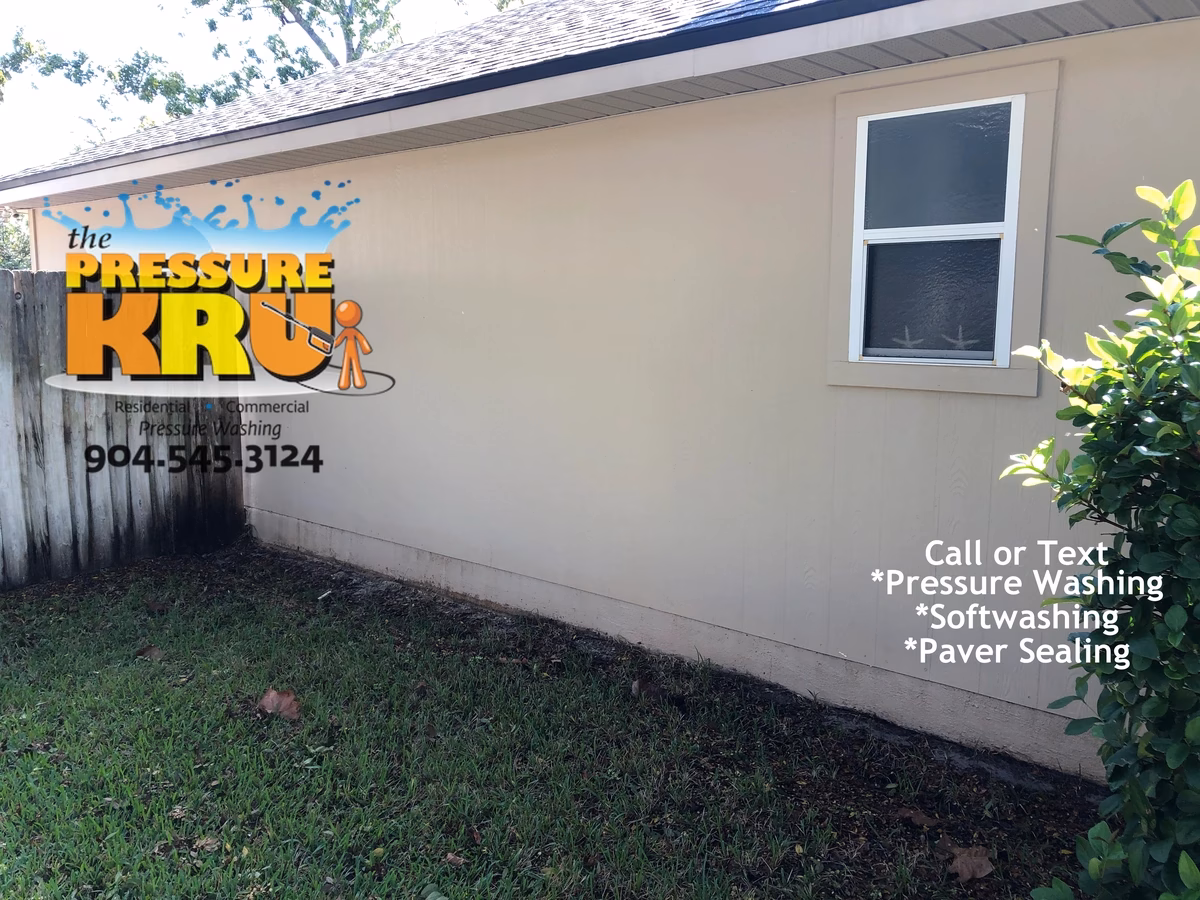 Professional house washing service removing algae from siding and vinyl soffits in Hatton Chase neighborhood.