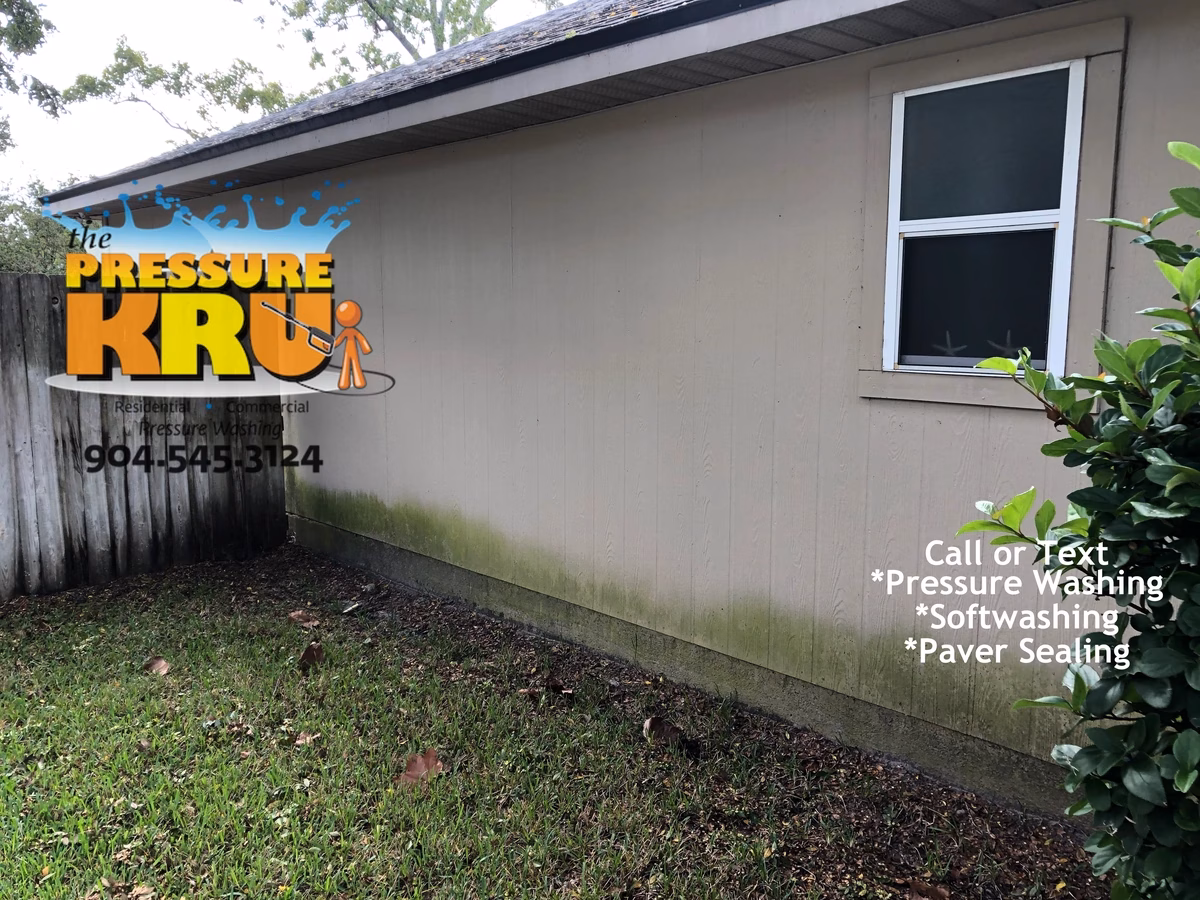 Professional house washing service removing algae from siding and vinyl soffits in Hatton Chase neighborhood.