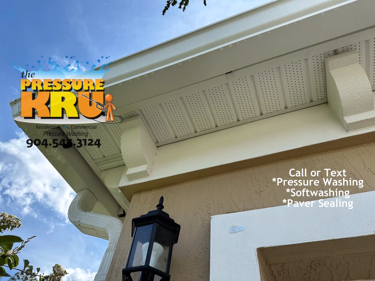 Stucco home cleaning with gutters and trim after receiving Low-pressure softwash cleaning in Julington Creek