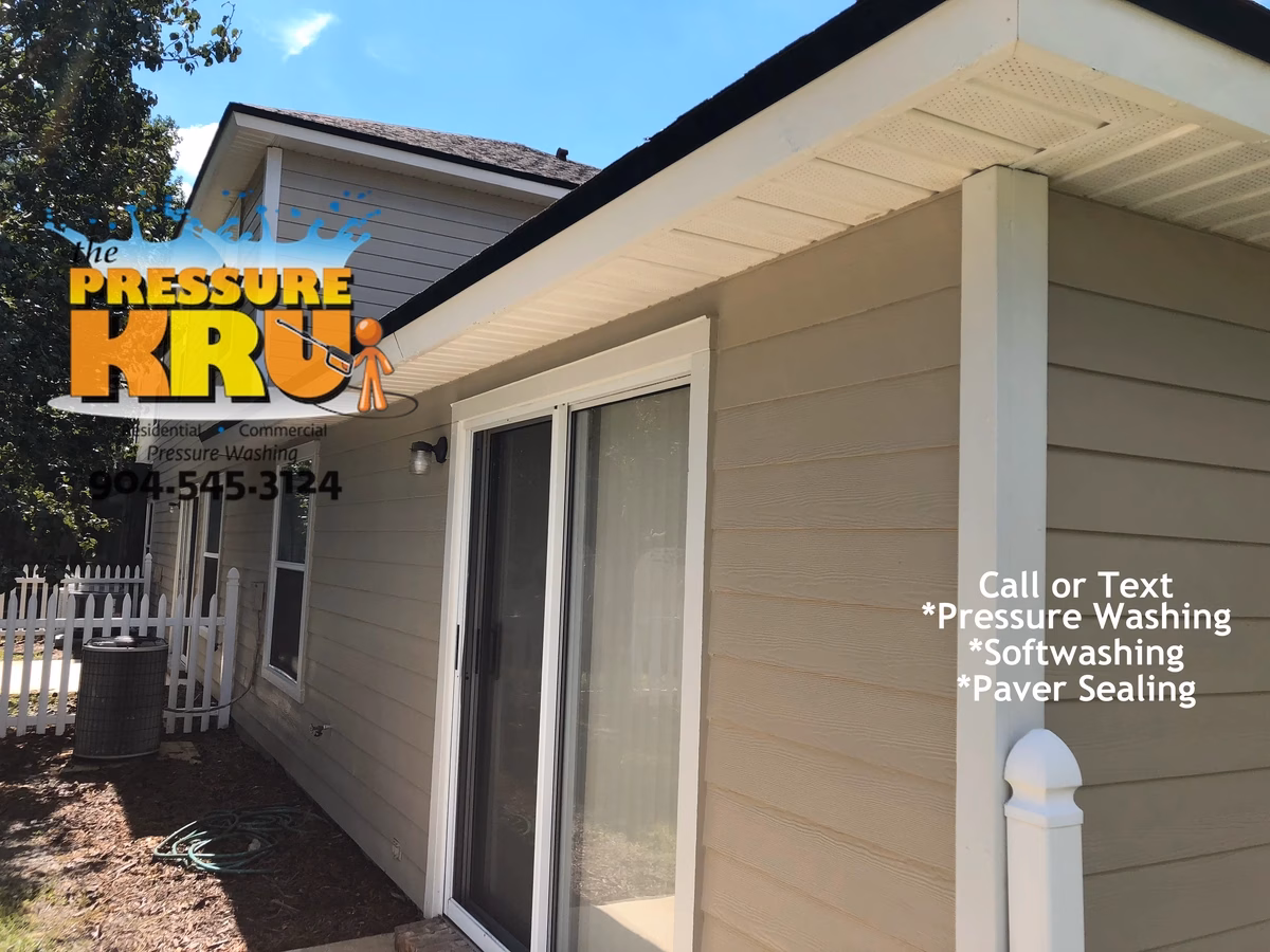 Professional house washing removes algae from siding and vinyl soffits in Southbridge Julington Creek Town home development.