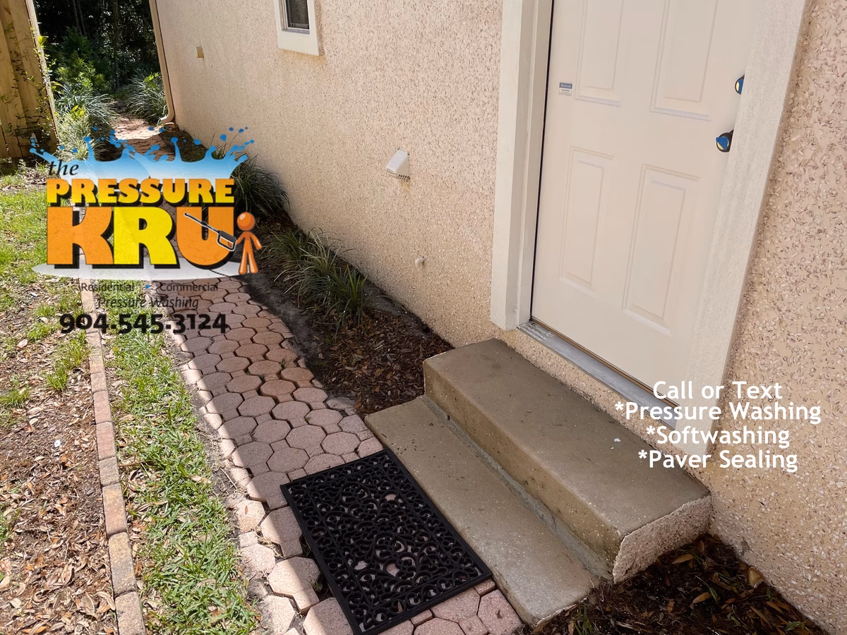 Soft wash coquina exterior in Sawgrass preserving natural stone finish. Image is after cleaning.