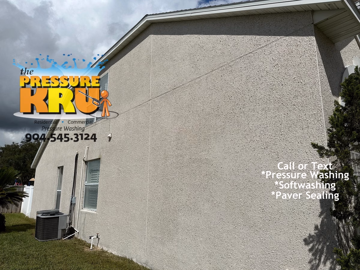 Freshly cleaned coquina siding in Murabella after image.