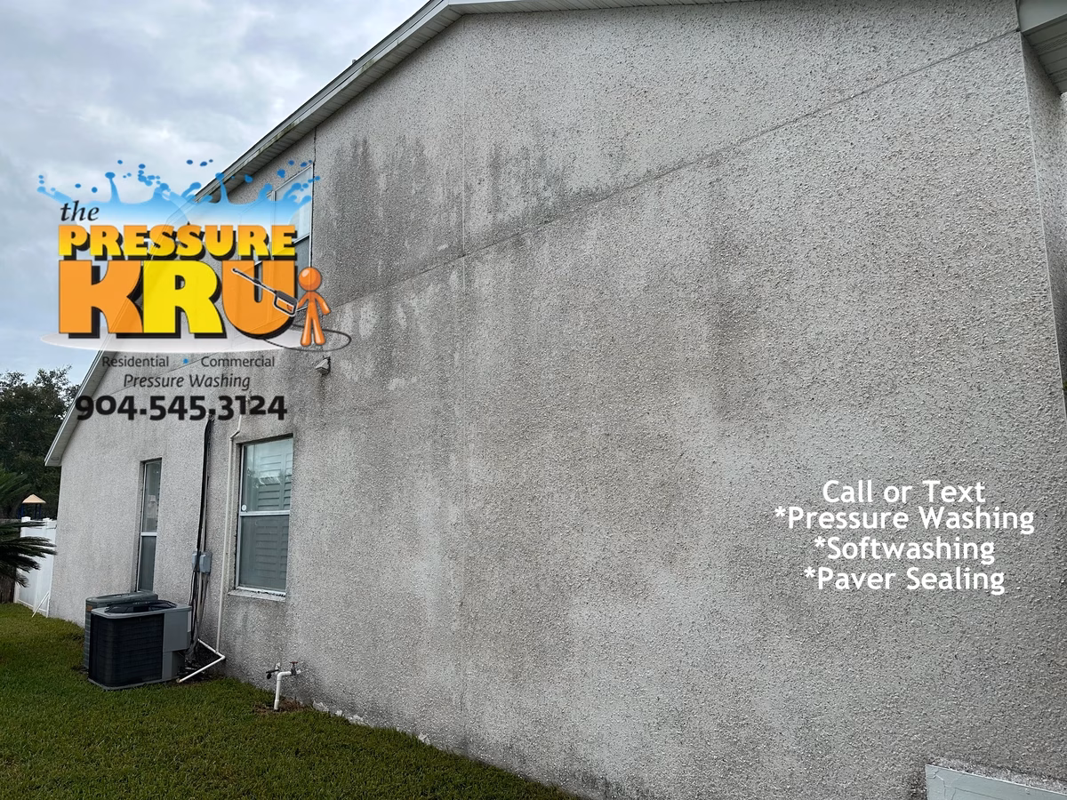 Freshly cleaned coquina siding in Murabella before image.