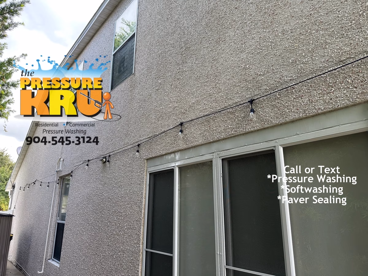 Soft wash coquina exterior in World Golf Village preserving natural stone finish. After removing mildew and organic growth.