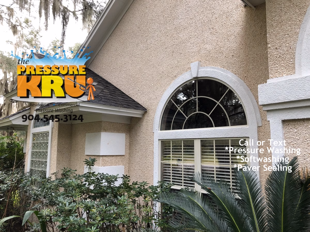 Exterior coquina house washing in Greenbriar after removing organic growth safely