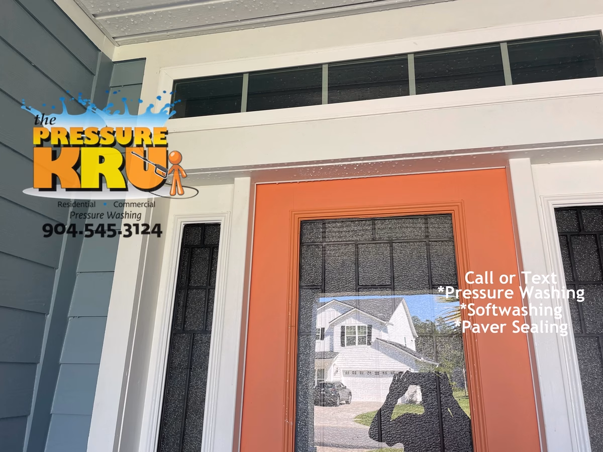 House washing service safely removing mold from siding and soffits in The Preserve at St. Johns neighborhood.
