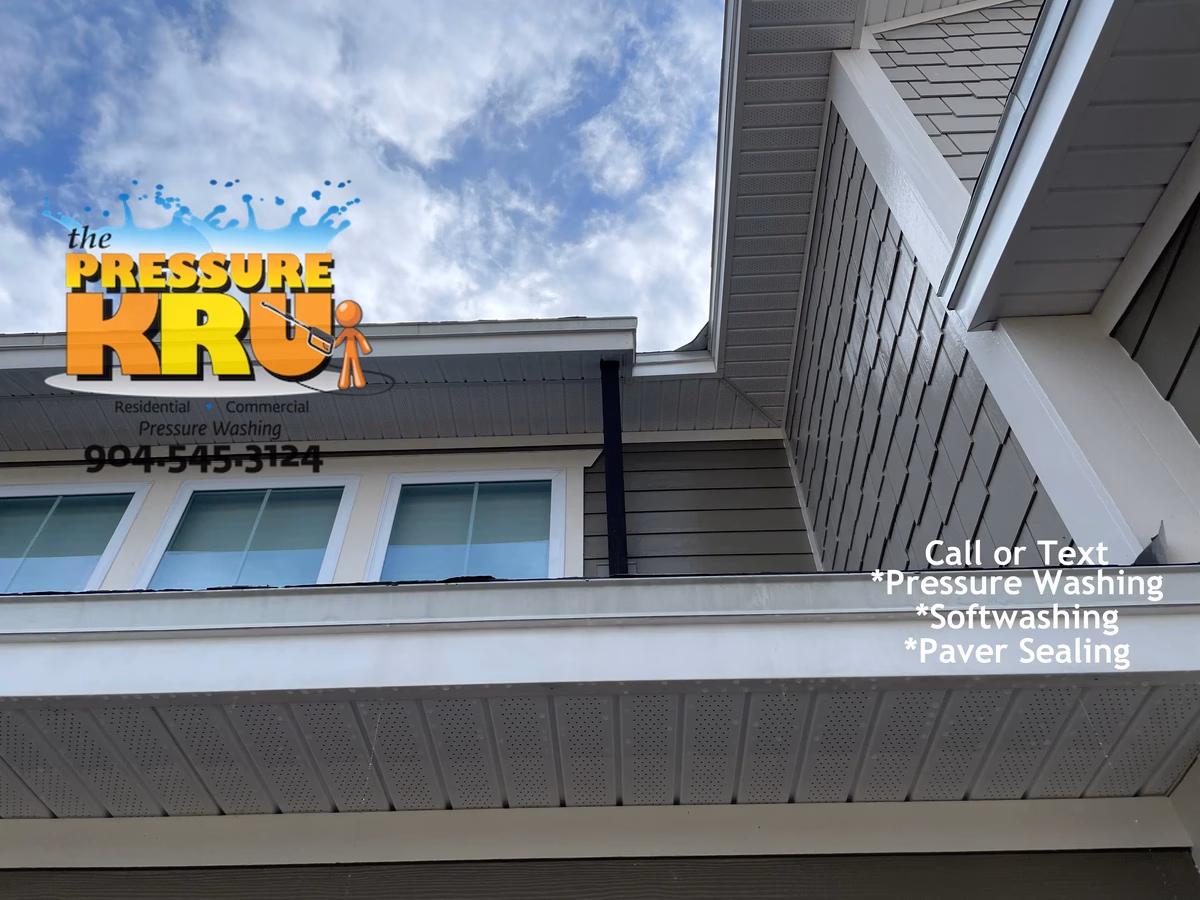 Before and after soft washing a home exterior in Shearwater neighborhood.