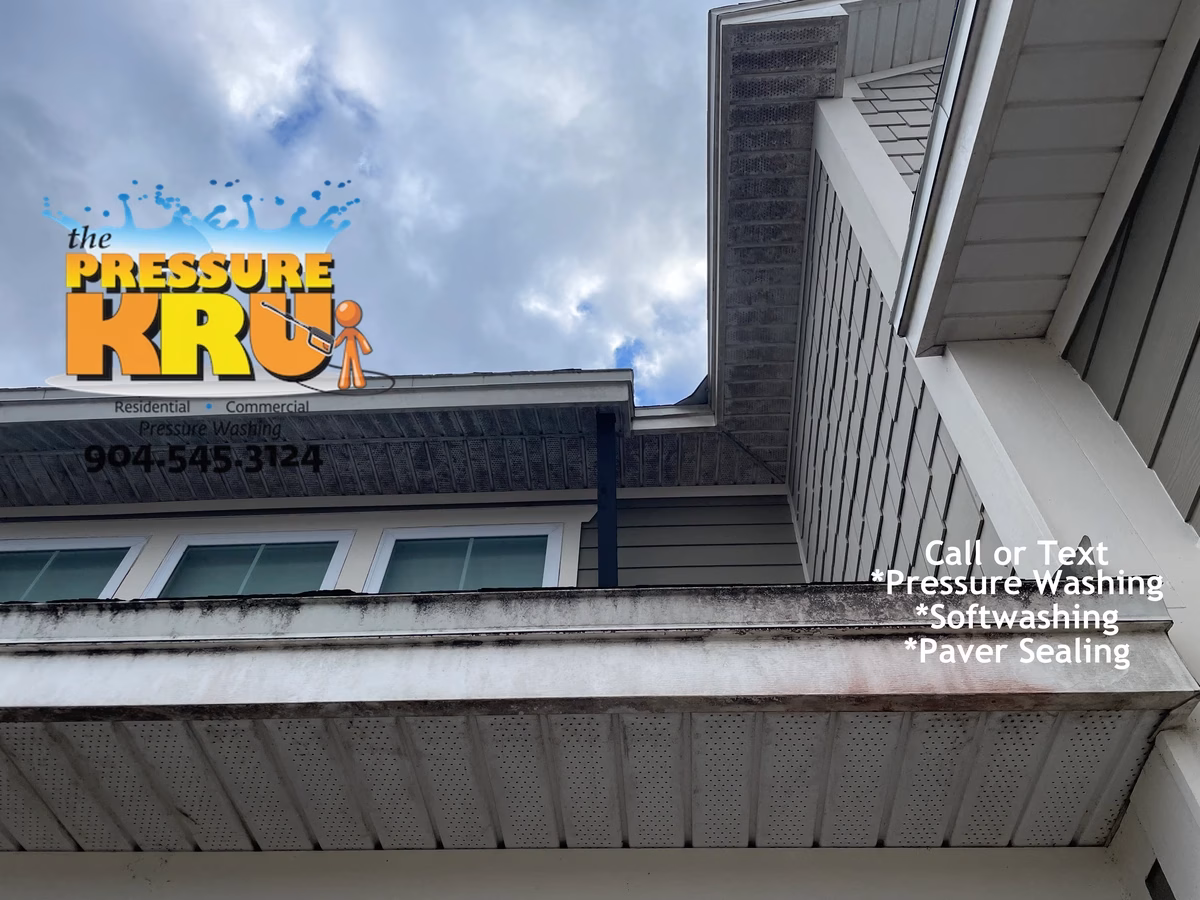 Before and after soft washing a home exterior in Shearwater neighborhood.