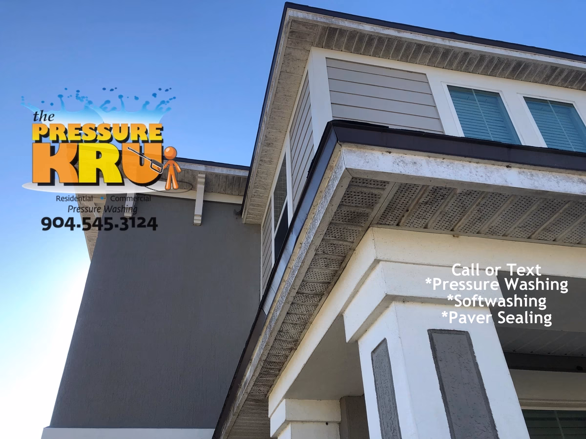 house washing contractor cleaning stucco siding in Bartram Park before softwash