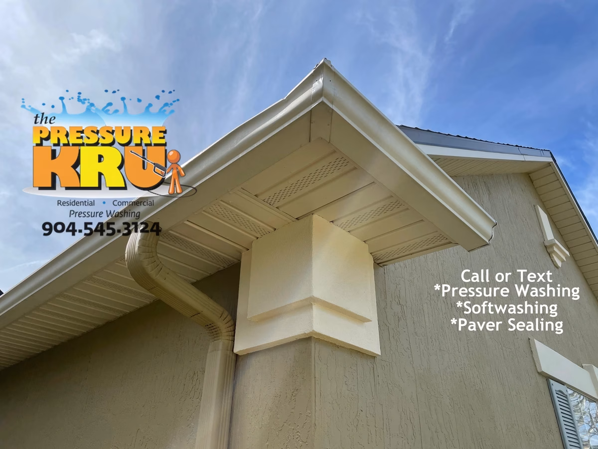 Stucco home gutters and vinyl cleaned to brand new conditions with our softwash cleaning system in Nocatee FL.
