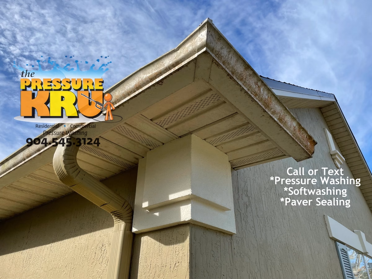 Stucco home gutters and vinyl cleaned to brand new conditions with our softwash cleaning system in Nocatee FL.