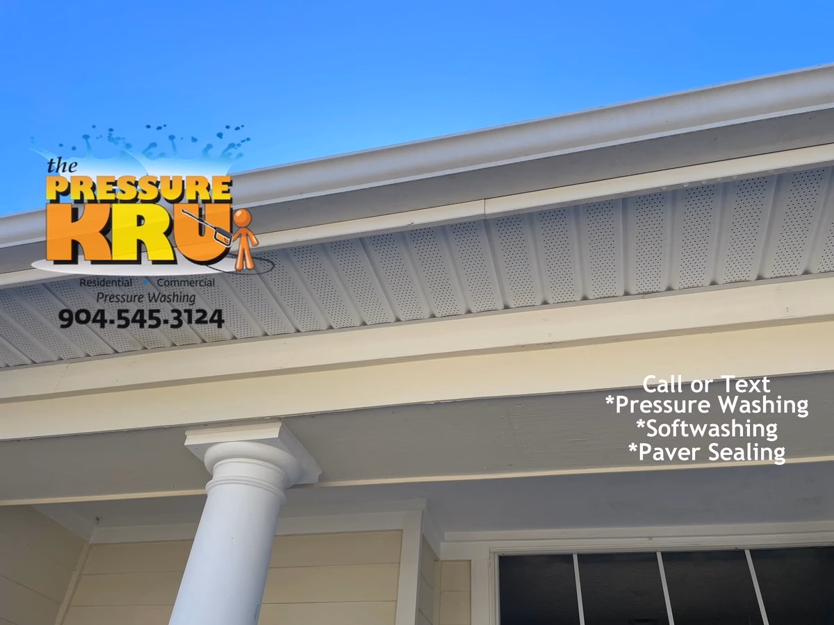 Soft washing home exterior in St. Johns Golf and Country Club neighborhood removing algae.