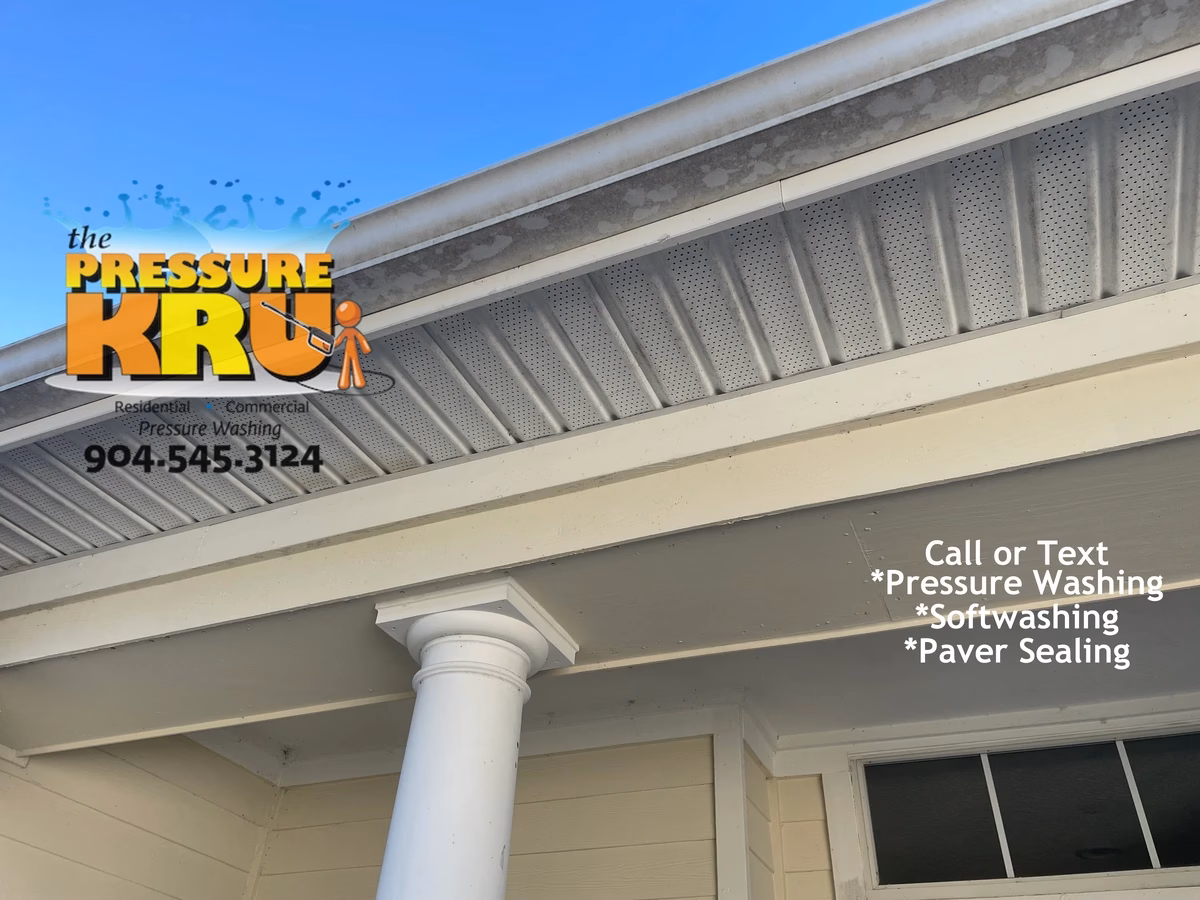Soft washing home exterior in St. Johns Golf and Country Club neighborhood removing algae.