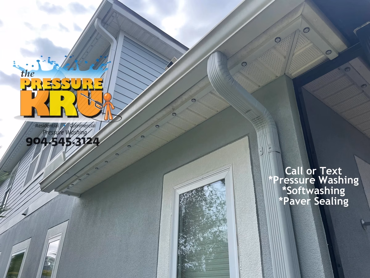 Soft washing home exterior in Julington Creek Plantation neighborhood removing algae.