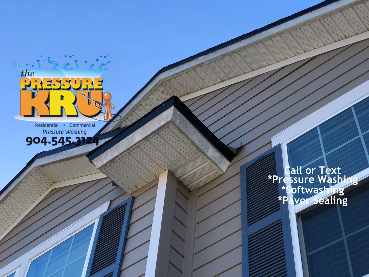 Soft washing home exterior in Julington Creek neighborhood removing algae.
