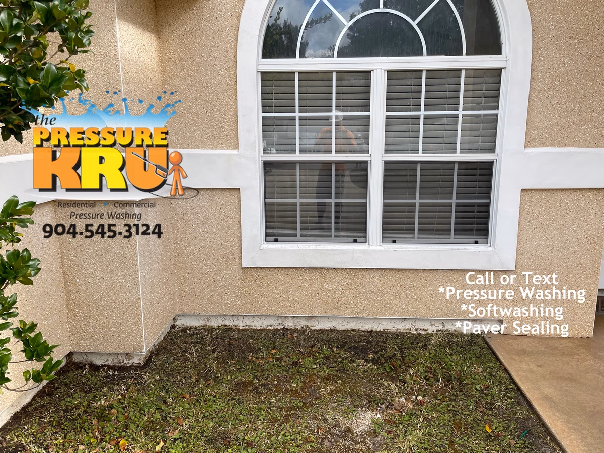 Coquina exterior cleaning in Deerwood country club removing algae and mold after cleaning.