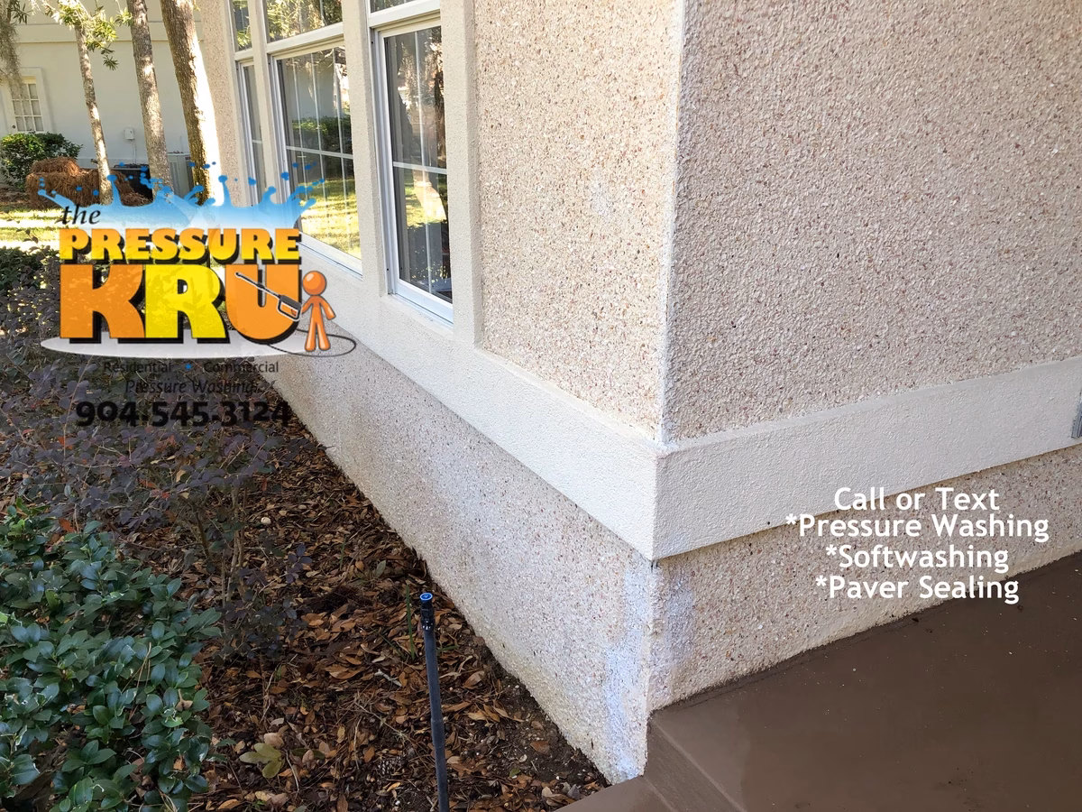 Professional coquina cleaning for a Majestic Oaks home before softwash solutions are applied.