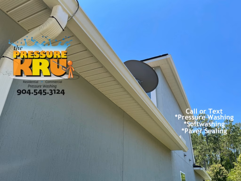 Clean white trim on stucco home in St Johns forest after professional soft washing.