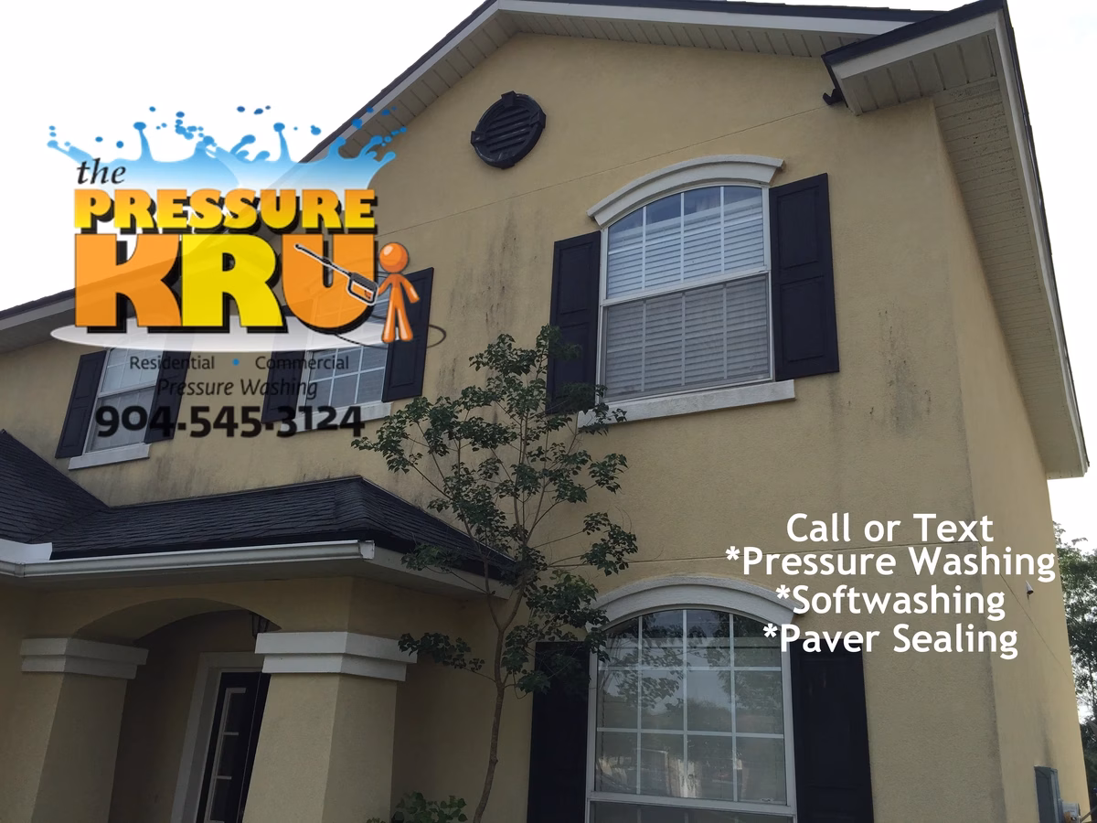 Soft washing service safely cleans two-story stucco home in Aberdeen before washing.