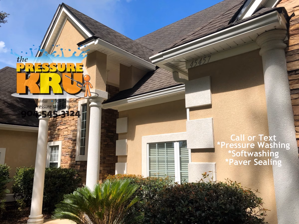 Safe soft washing process cleaning home in Yulee after application.