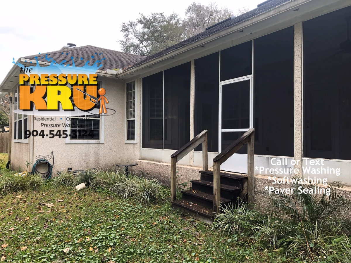 Professional coquina exterior home cleaning in Sawmill Lakes before organic growth removal.