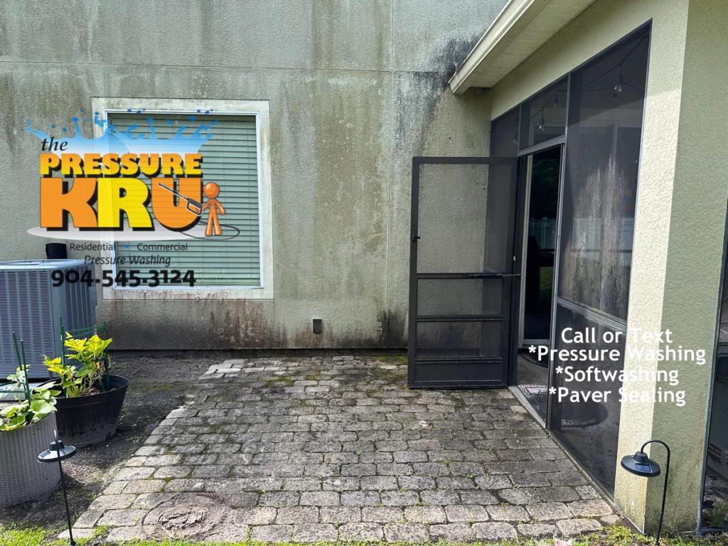 Professional Stucco house washing before low-pressure washing in Durbin.