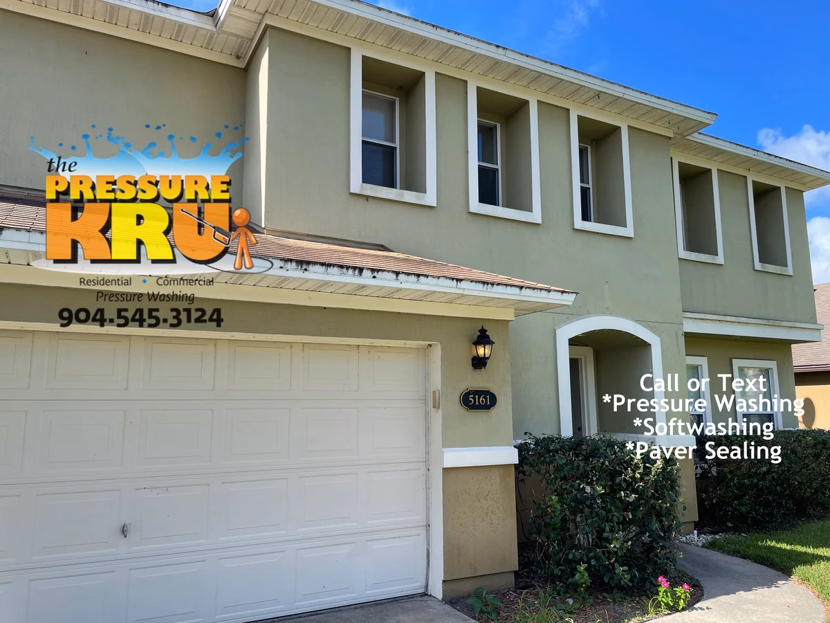 Residential stucco exterior free of algae before professional house washing in Jacksonville Florida.