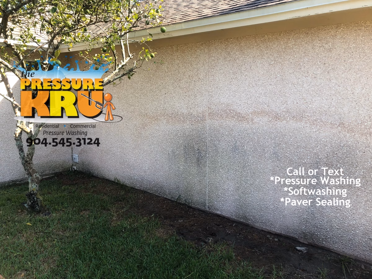 Pressure washing coquina siding in Julington Creek Plantation Before