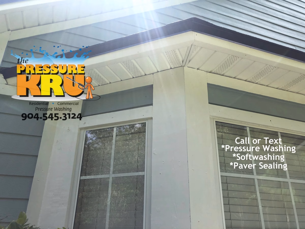 Professional pressure washing home exterior in Orange Park Country Club neighborhood.
