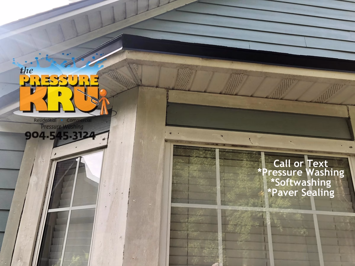 Professional pressure washing home exterior in Orange Park Country Club neighborhood.