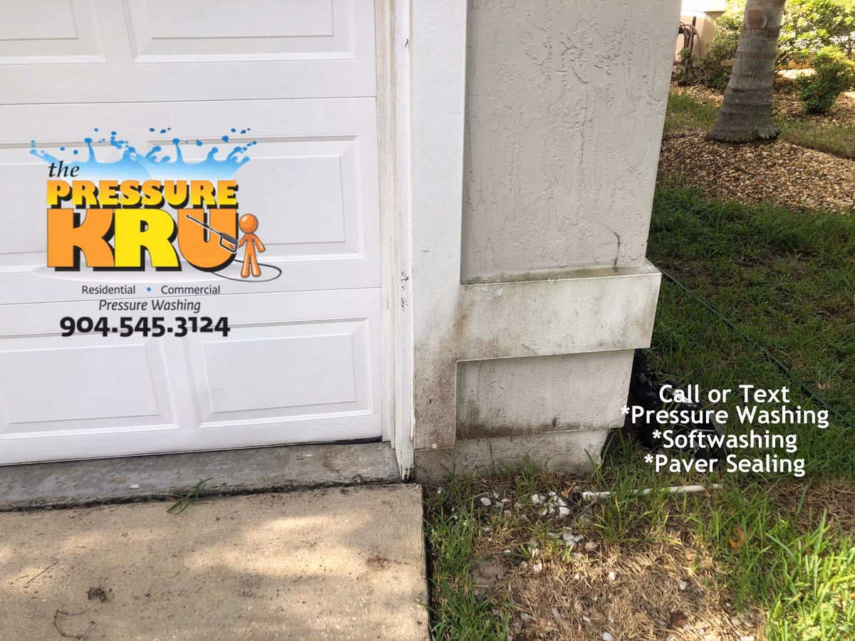 Cleaning stucco exterior before soft washing in Baymeadows Jacksonville.