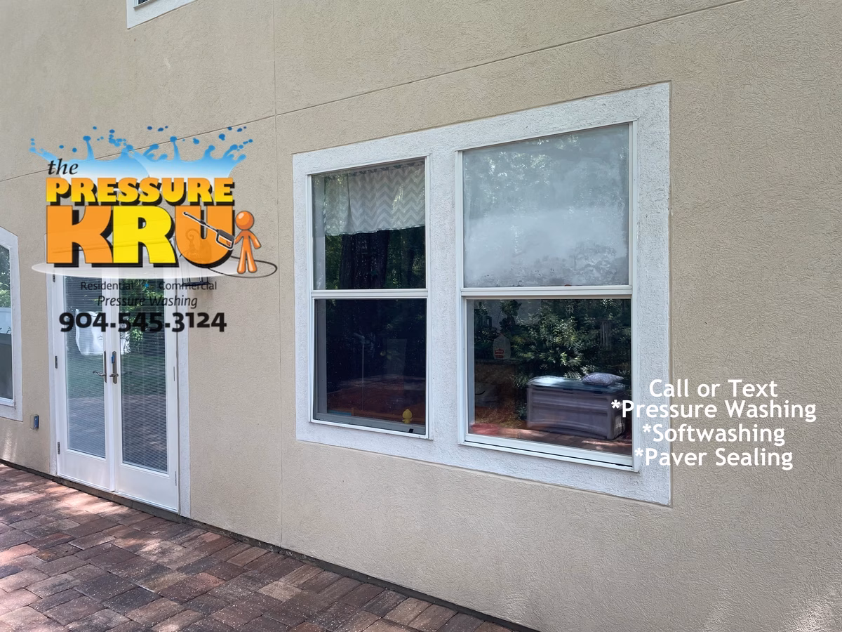 Stucco home after exterior clean using safe soft wash methods in Nocatee neighborhood.