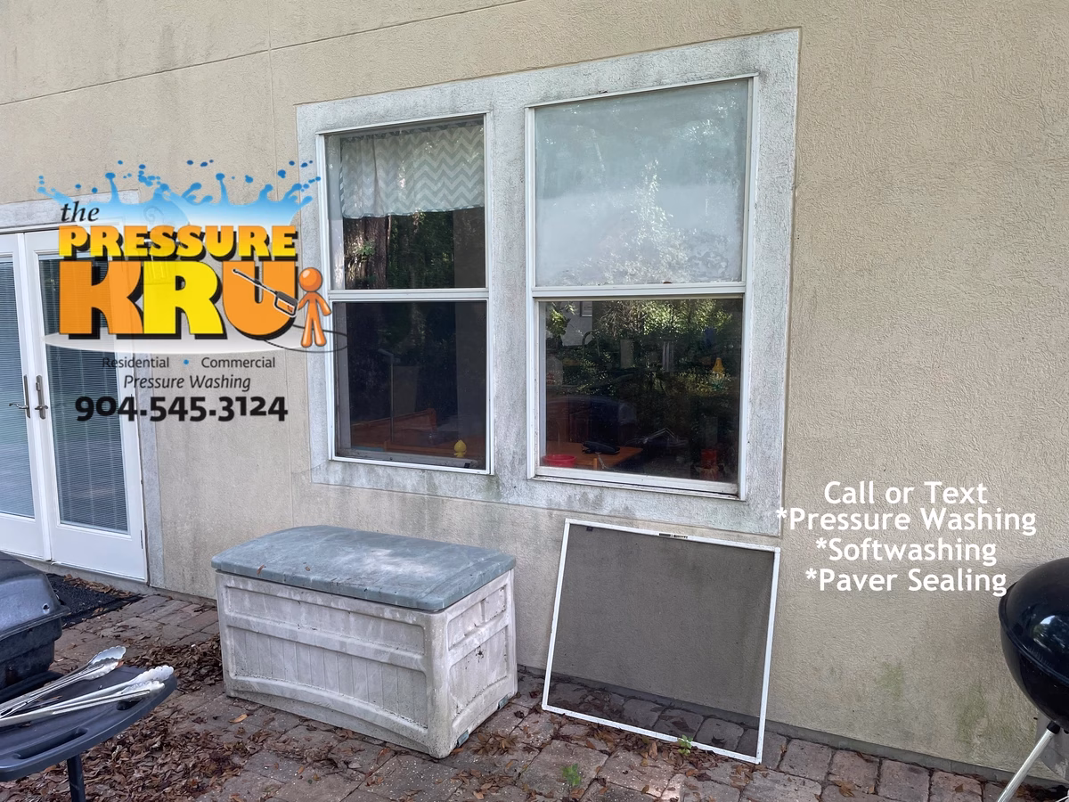 Stucco home before exterior clean using safe soft wash methods in Nocatee neighborhood.