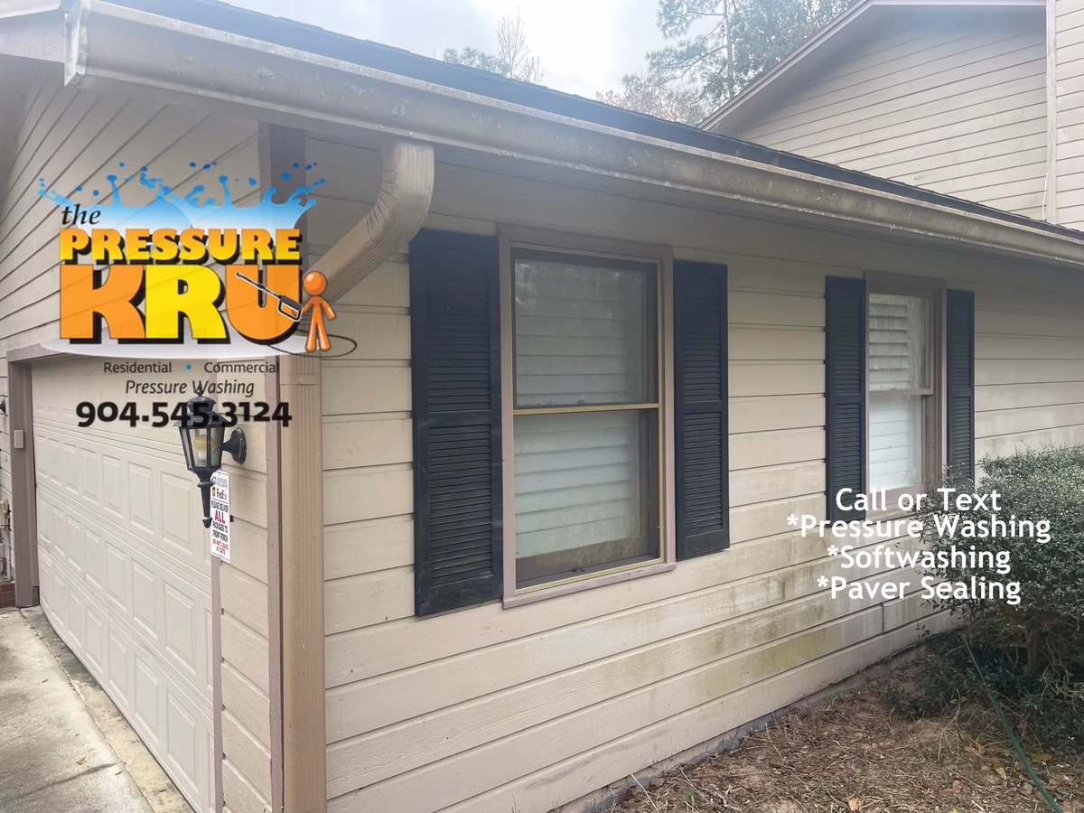 Before soft washing mold-covered wood siding home in Orange Park Golf and Country Club.