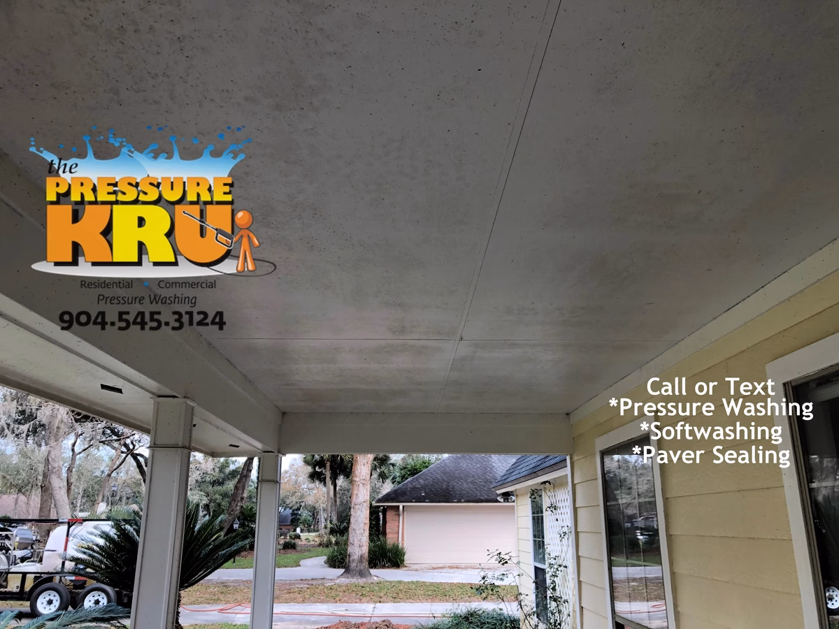 Before soft washing mold-covered Hardie board home in Orange Park Golf and Country Club.