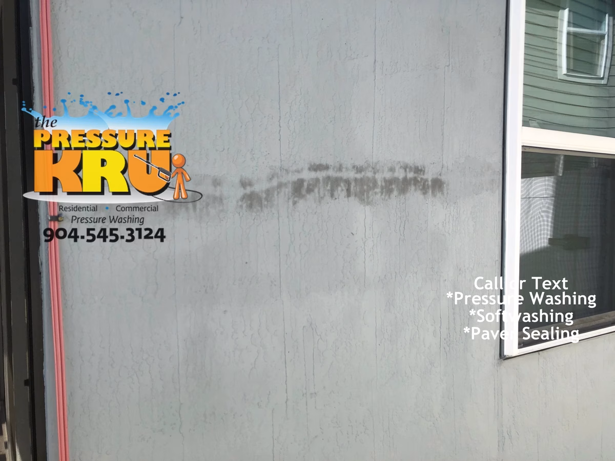 Soft Washing a Stucco home to remove mold and mildew in Julington Creek before.