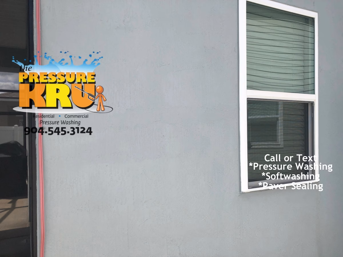 Soft Washing a Stucco home to remove mold and mildew in Julington Creek after.