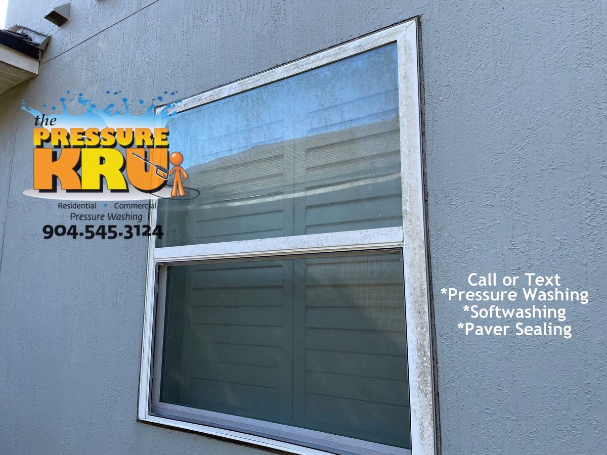 Residential exterior soft washing service for stucco home in Julington Creek Plantation gentle on windows before