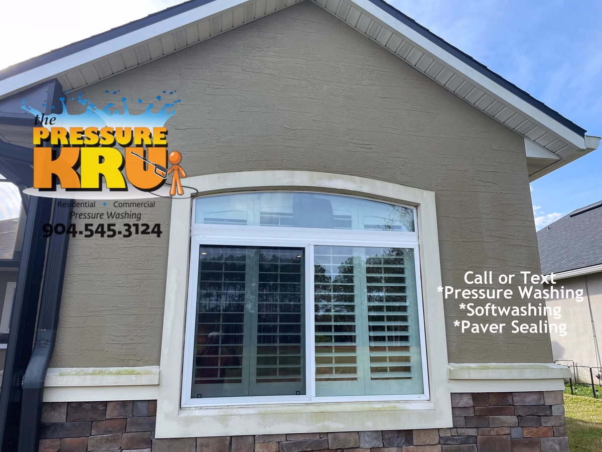Freshly cleaned stucco home before low-pressure soft washing in Bartram Springs