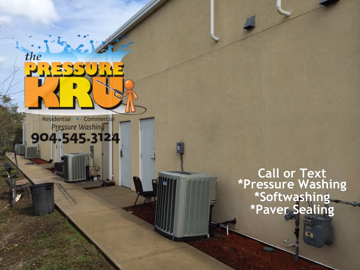 House washing contractor cleaning stucco siding for home in Julington Creek after