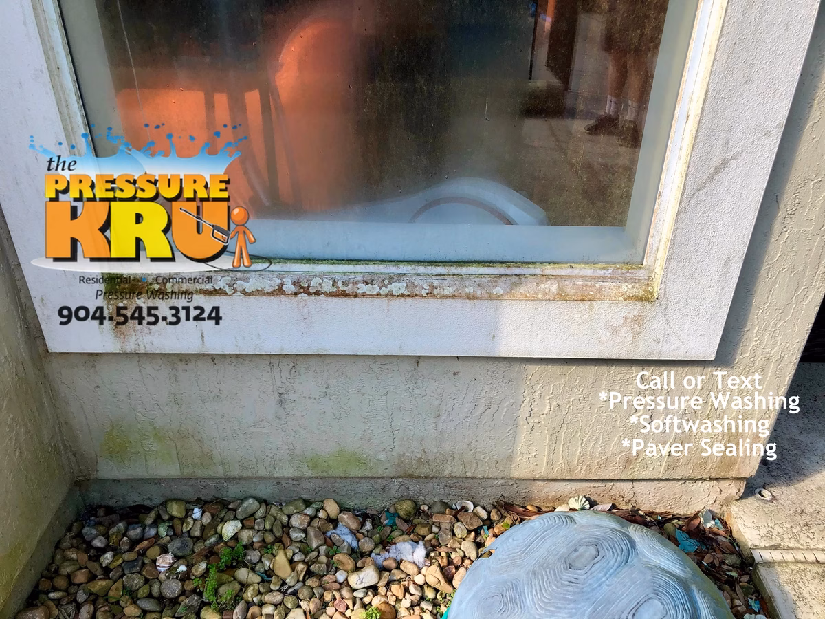 Professional house washing restoring a stucco homes curb appeal in South Hampton Before.