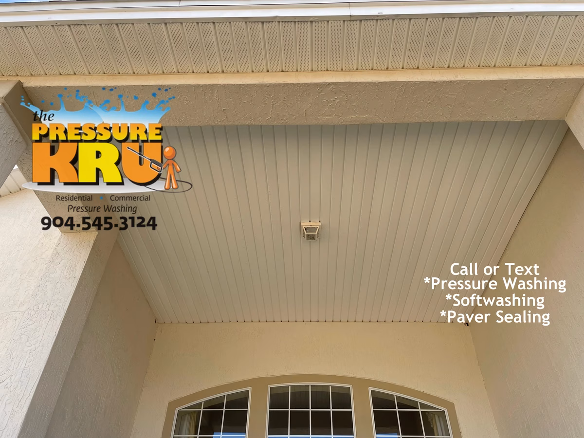 Two-story after soft washing service cleaning dirty stucco walls and soffits in World Golf Village.