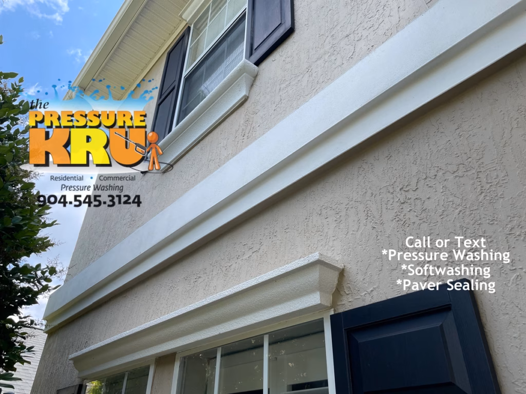 Residential exterior after soft washing service for Stucco home in Bartram Springs.