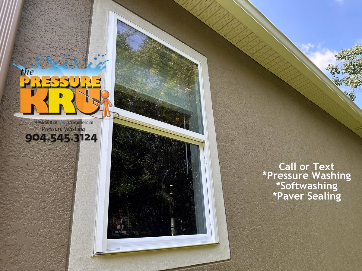 Softwashing a two-story stucco house in Nocatee After.