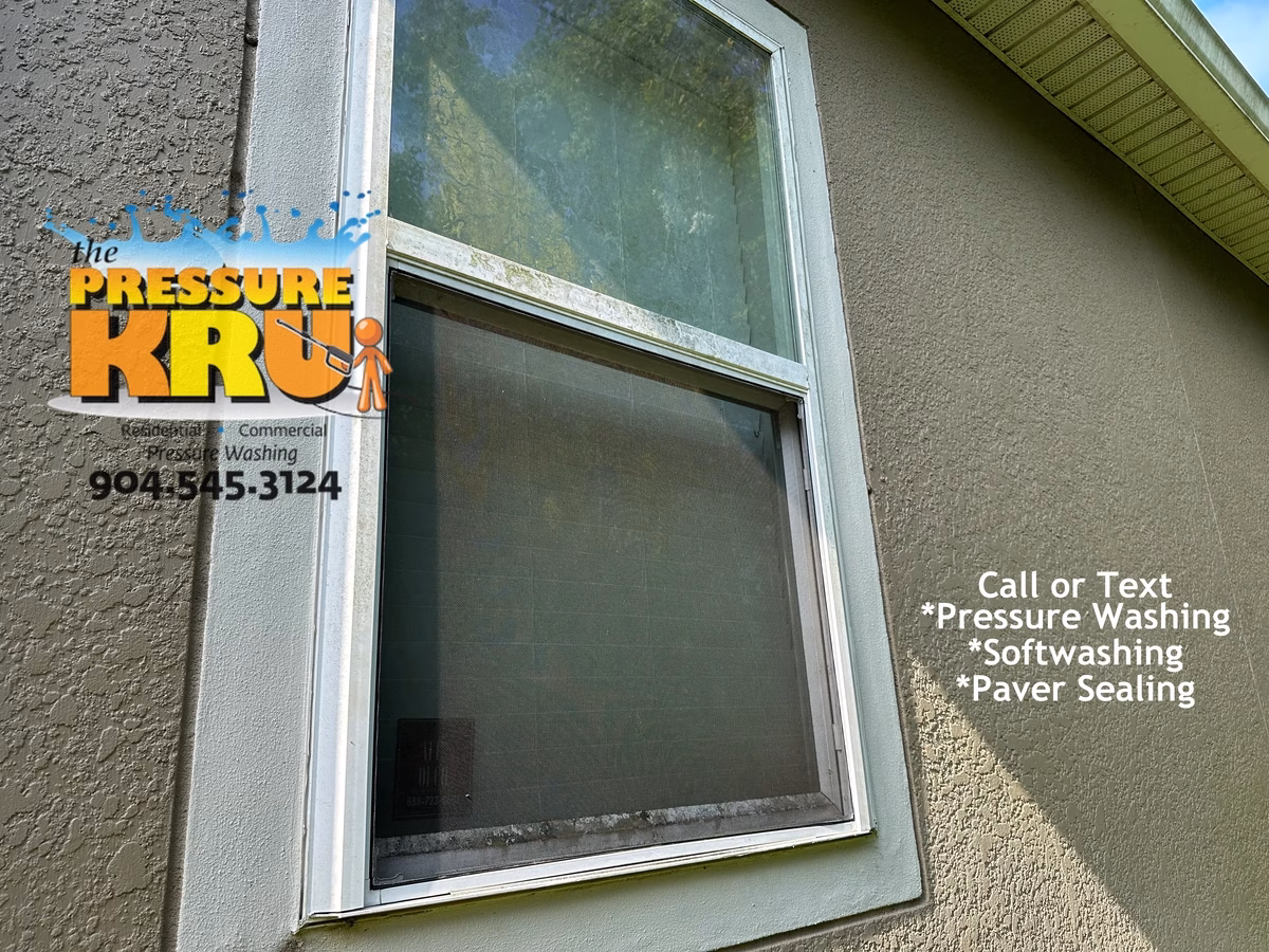 Softwashing a two-story stucco house in Nocatee before.