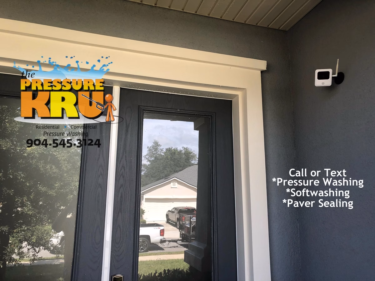 Professional stucco house washing in Aberdeen after showing clean caulk and trim.