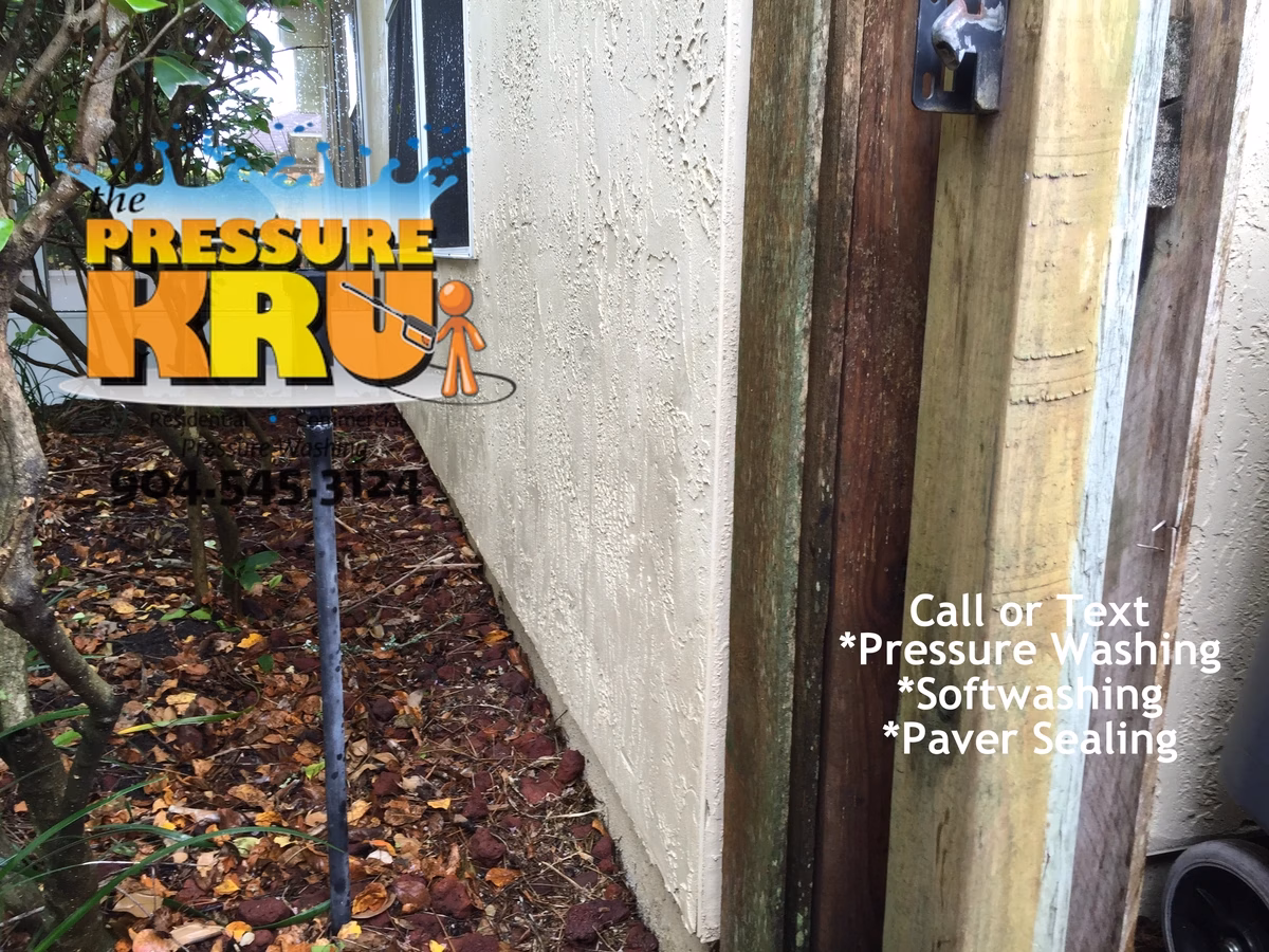 Stucco house washing service after removing algae from a home in South Hampton.