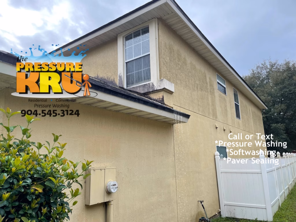 Soft washing service before cleaning dirty stucco walls in Jacksonville Florida