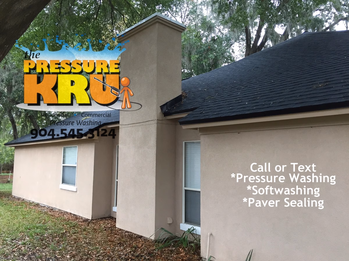 Residential stucco house soft wash after being completed in Deerwood.