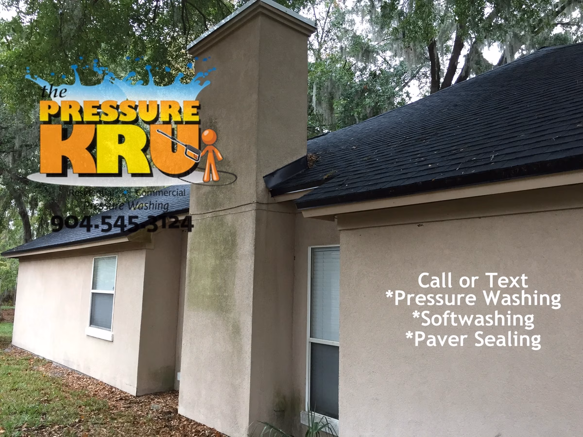 Residential stucco house soft wash before being completed in Deerwood.
